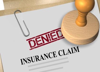 Denied Insurance Claim Paper and Stamp