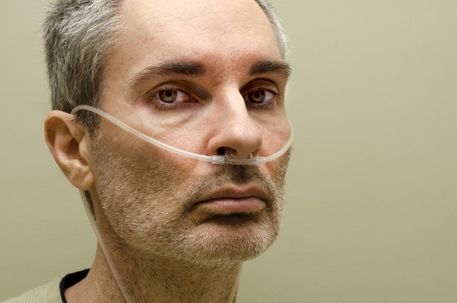 a man with oxygen tubes