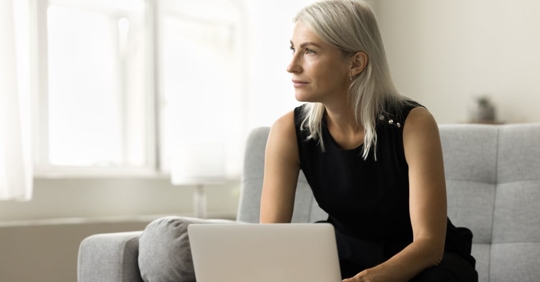 Woman on her laptop after consulting with Dabdoub Law Firm about her ERISA claim.