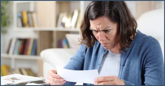 Woman upset looking at her denial of her disability claim