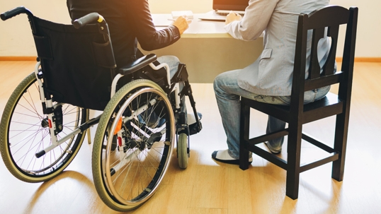 disabled person meeting with a lawyer