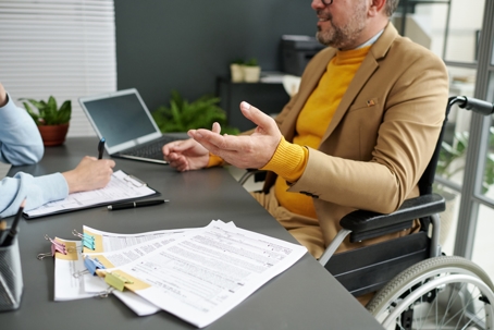 man with disability reviewing documents